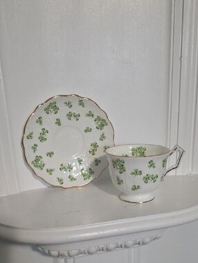 vintage Aynsley fine bone china teacup and saucer set featuring a green shamrock